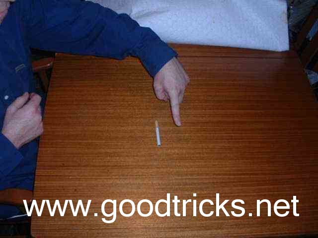 Hold finger above cigarette, blow gently and move finger forward, ahead of the cigarette.