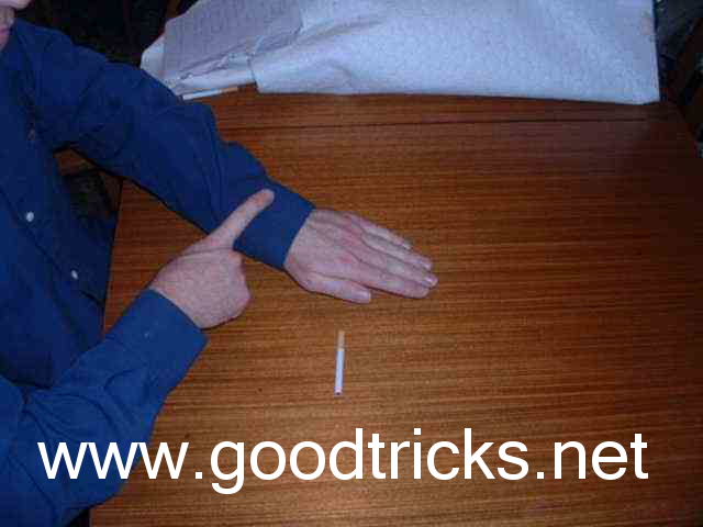 Rub finger on arm to give the impression of charging it.