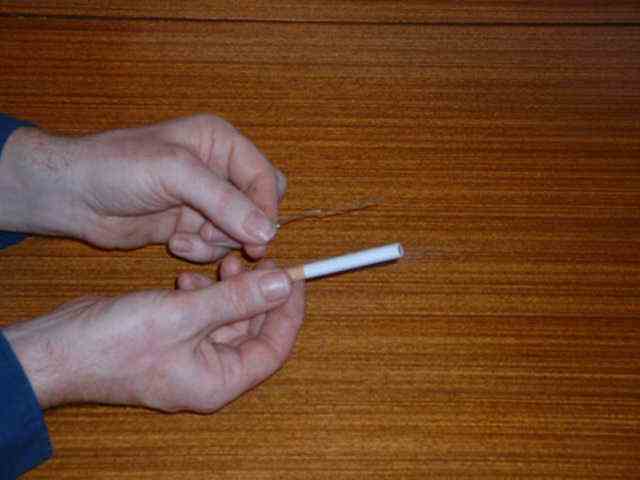 Straighten out the paperclip.