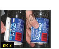 When coin positioned in bottle, glue back the label.