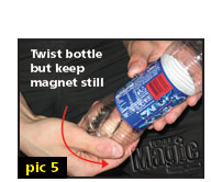 Twist bottle while coin and magnet remain in place.