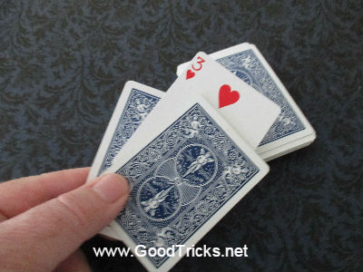 Ace card appearing in the middle of two other playing cards.