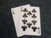 Ace and ten of clubs winning Blackjack hand.