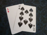 Blackjack ace and ten of spades.