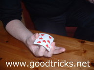 First finger should be flicked , causing top card to jump into the air.
