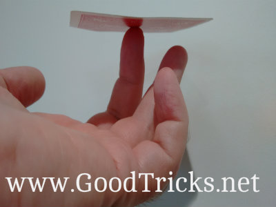 With the center of the card resting on your finger. The card should remain balanced horizontally. 