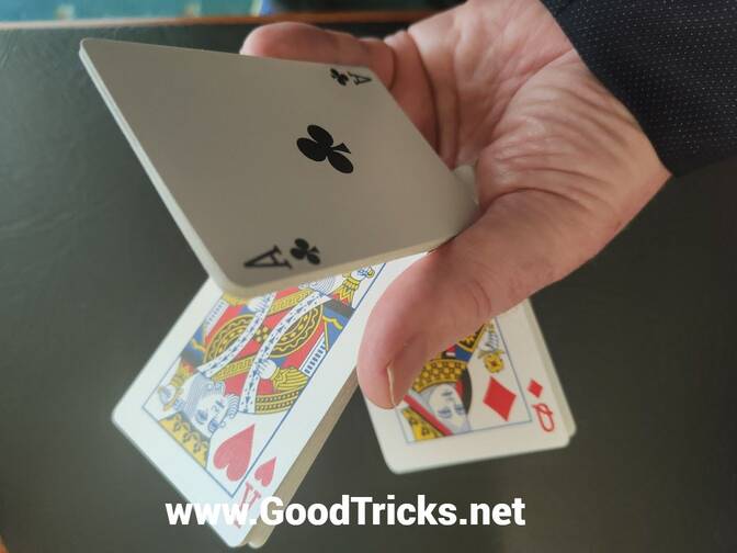 magician demonstrating card sleights in his hand.