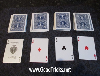 Four aces shown that were on top of each pile of cards in this fantastic magic trick.