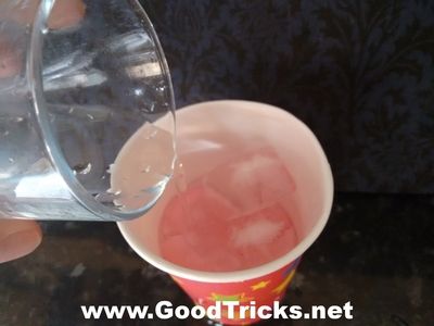 Image of cup containing small sponge ready to do a magic trick.