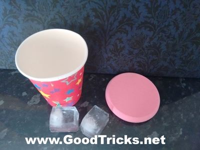 To perfom this magic trick you need a paper cup, some ice, a glass of water and a small piece of sponge.