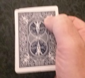 Correct thumb position for top right card.