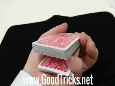 Obtain pinky break so that spectator's card will rest on yop of your pinky.