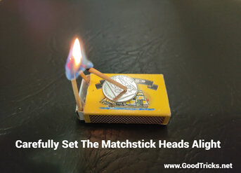 Three matchsticks are set alight,