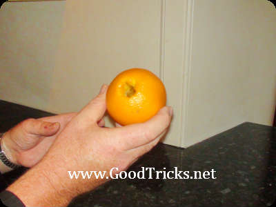 Take a fresh orange and carefully make a hole in one side towards the center.