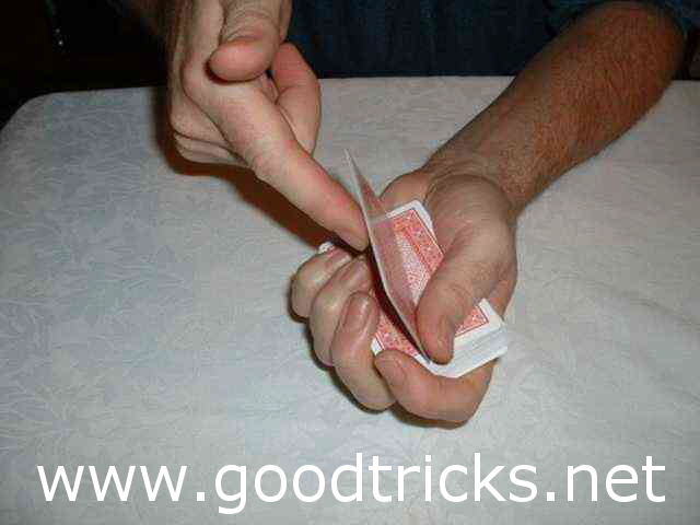 Flip over cards above the pinky break with forefinger of other hand and use thumb of holding hand to assist the move.