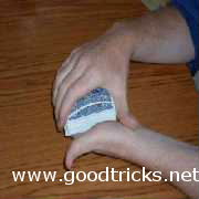 Place palm of other hand on top card and squeeze gently.