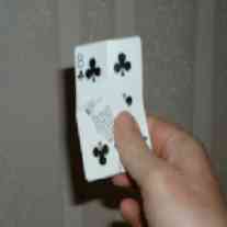 Hold extra piece of csrd in place with thumb.