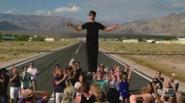 Criss Angel appears to be levitating in the air.