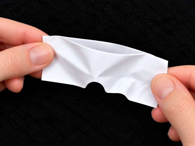 Folded paper bent to change the shape of the opening