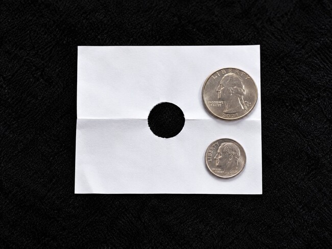 Shett of paper and two coins.