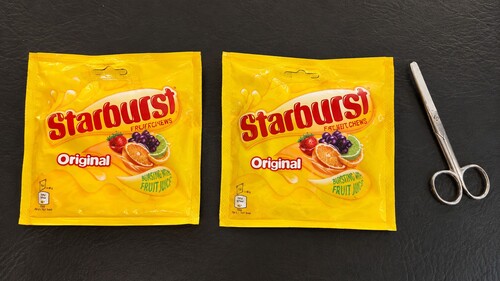 Two candy packets and scissors