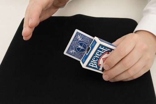 Card rising out of a closed box of cards.