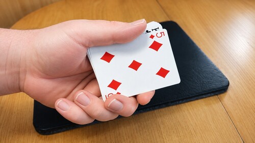 The selected card being placed on the bottom of the deck