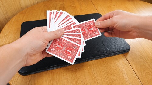 A spectator choosing a card for the Rising Card Trick