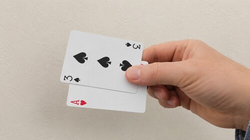 Two contrasting playing cards ready for the Snap Change