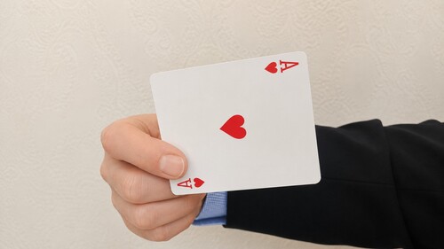 Original playing card hidden behind the newly revealed card