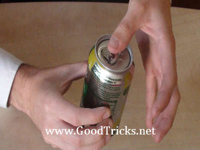 Opening the can and pushing in the coin