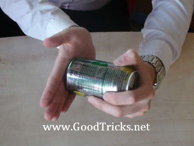 Coin striking the bottom of the can