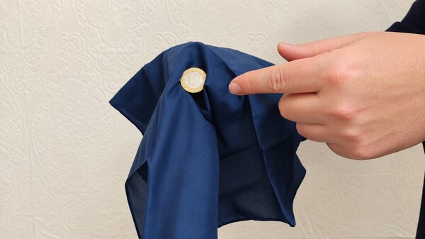 Make a coin appear out of nowhere.