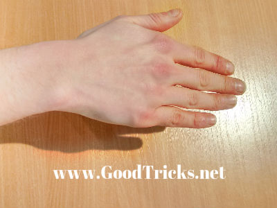 The coin is now  held in palm position with the muscles on the back of the hand, clenching the coin. The other side of the hand, visible to the spectator will look natural and can be held in a natural position after a little practice.