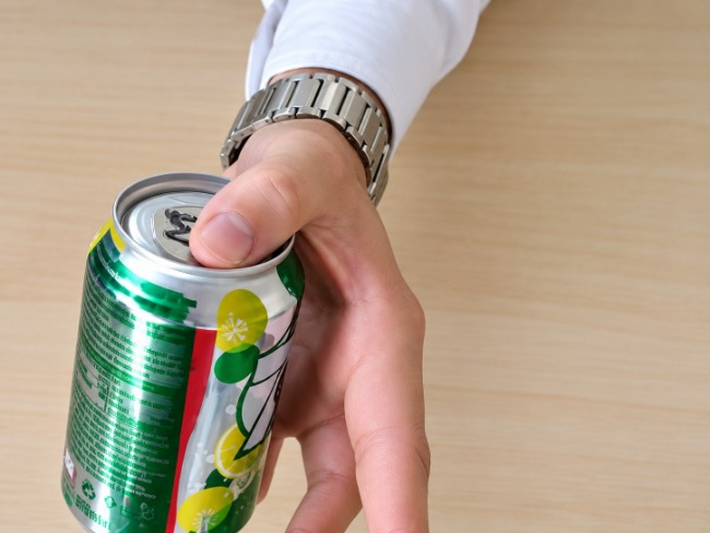 Coin appears from inside a can..