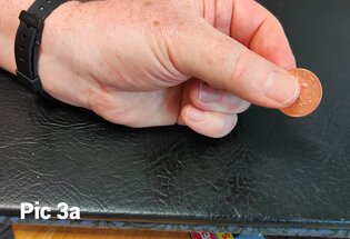Spectator view of the coin with the hidden magnet concealed