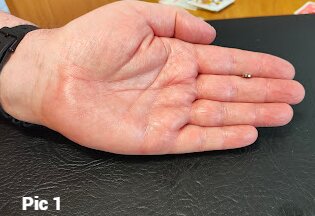 Coin spin trick, showing hidden magnet.