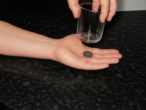 Coin in glass trick.