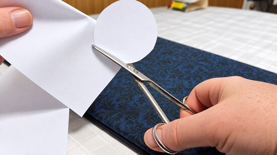 Cutting a paper circle to fit the glass rim