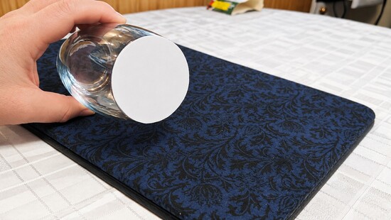 Attaching the paper circle to the rim of the glass