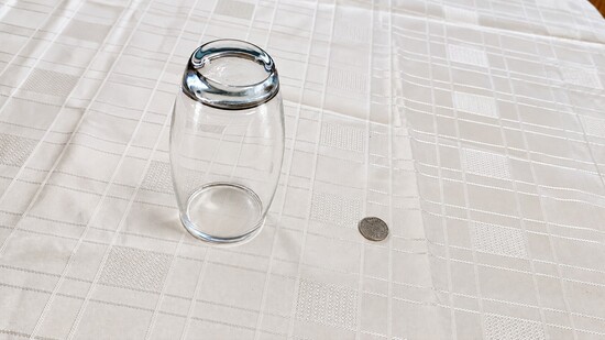 Setting the glass and coin on a matching surface