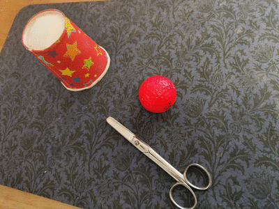 Items need to perform the cup and ball magic trick.