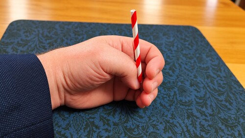 Short straw made to reappear in the magician's hand