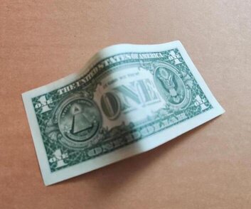 Dollar bills make great props for bar tricks.