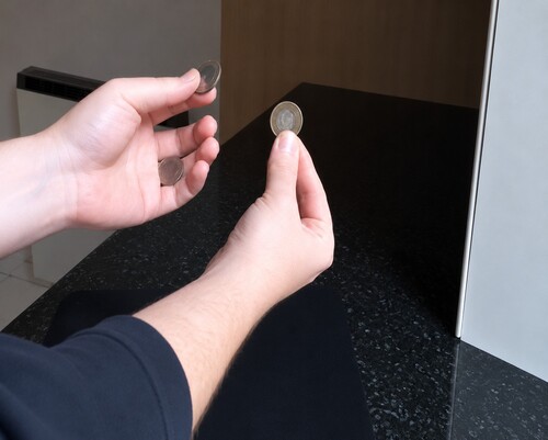 The two larger coins displayed to the audience after the transformation