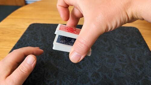 Deck transferred into the dominant hand while maintaining the break