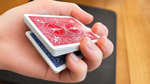 A pinky break held above the spectator's chosen card