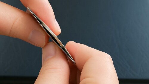 Coin apparently positioned inside the centre of the folded card