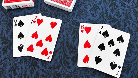 Two red and black pairs of matching number cards