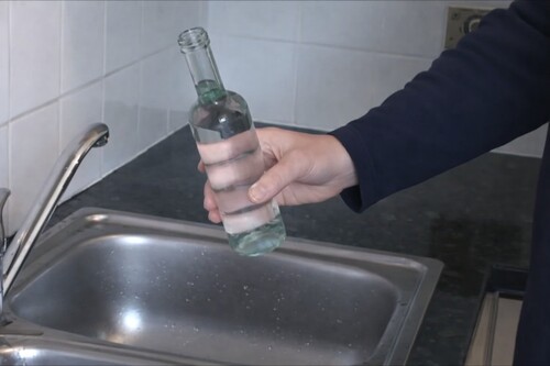 Fill bottle with water until almost full.